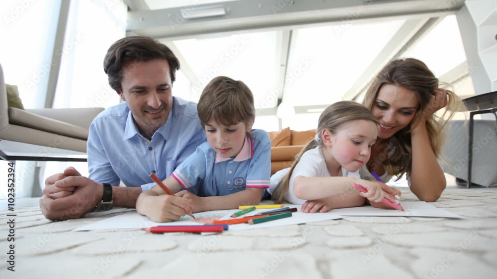 Smiling family drawing together Smiling family drawing together