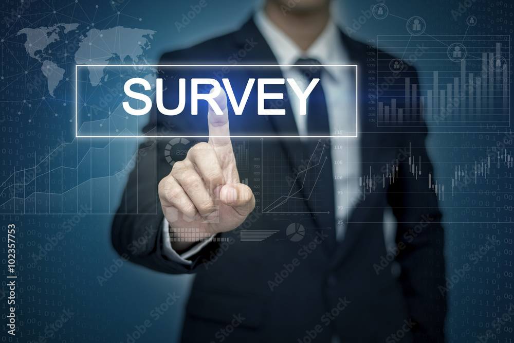 Businessman hand touching SURVEY button on virtual screen Businessman hand touching SURVEY button on virtual screen