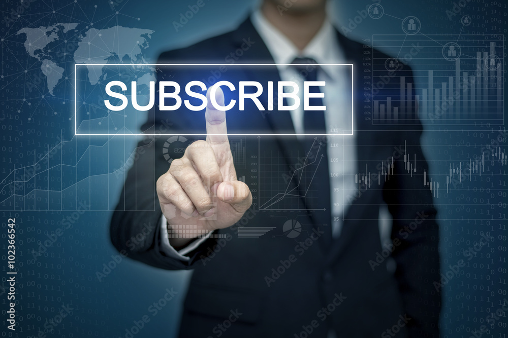 Businessman hand touching SUBSCRIBE button on virtual screen Businessman hand touching SUBSCRIBE button on virtual screen
