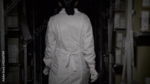 Archivist go between documents stored in archive