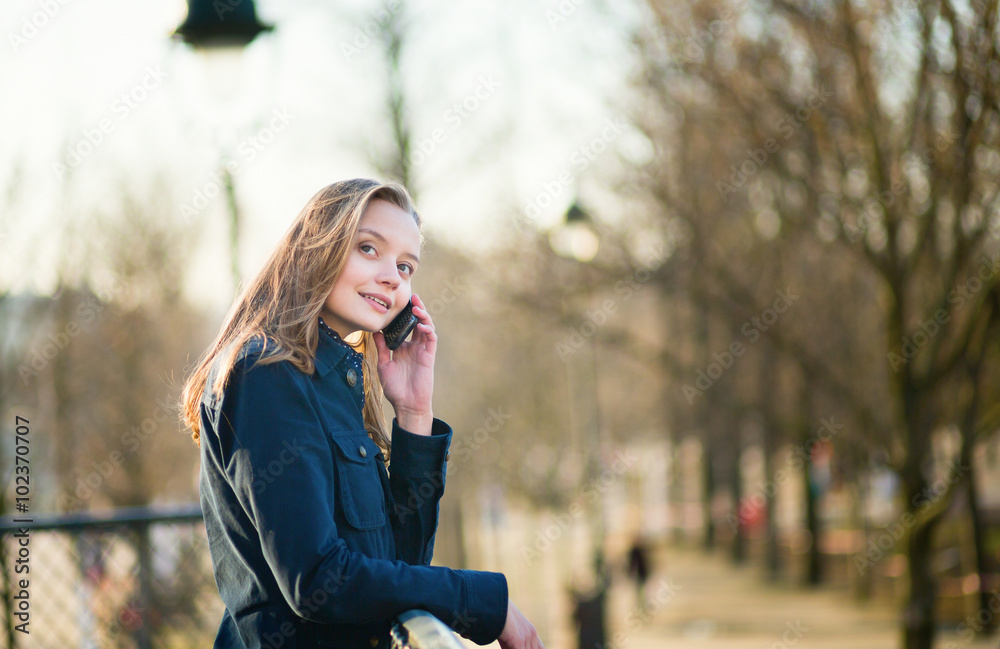 Woman speaking on the phone outdoors
