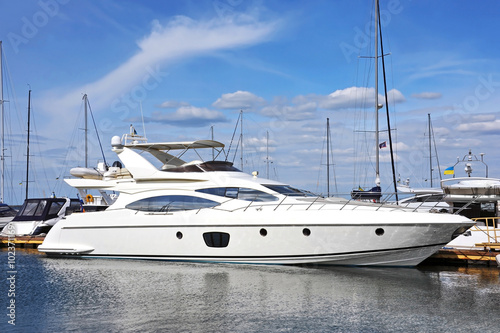 White motor yacht over harbor pier, Odessa, Ukraine