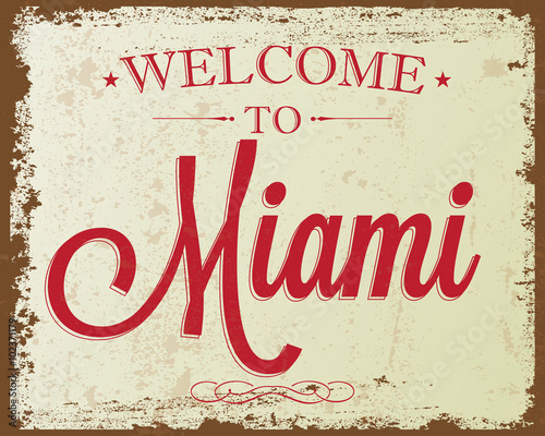 Touristic Retro Vintage Greeting sign, Typographical background "Welcome to Miami", Vector design. Texture effects can be easily turned off.