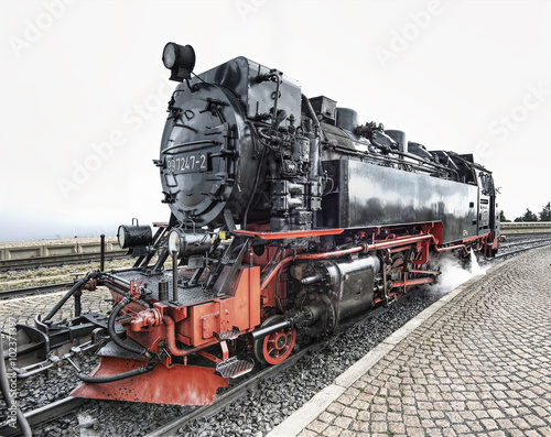historic German black steam powered railway train at Brocken station, Brocken, Harz, Germany, Europe