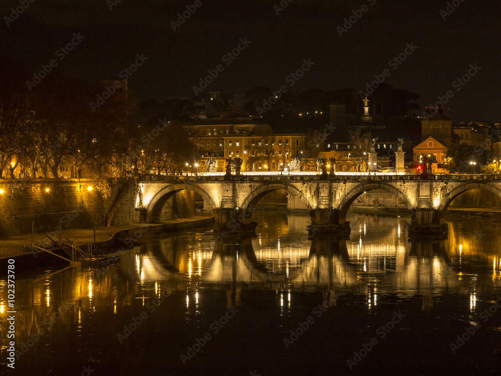Ponte Sant Sisto reflected in the Tiber river, Saint Peter dome