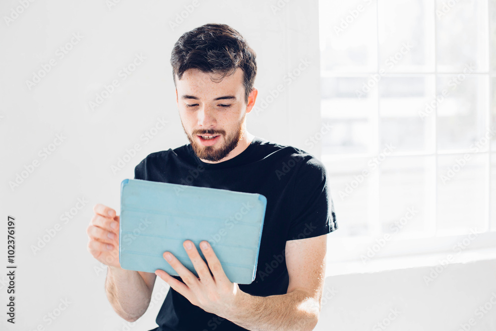 Man is played on the tablet. Man is played on the tablet.