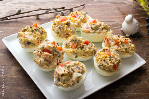 stuffed eggs with peppers, mushrooms and herbs - selective focus