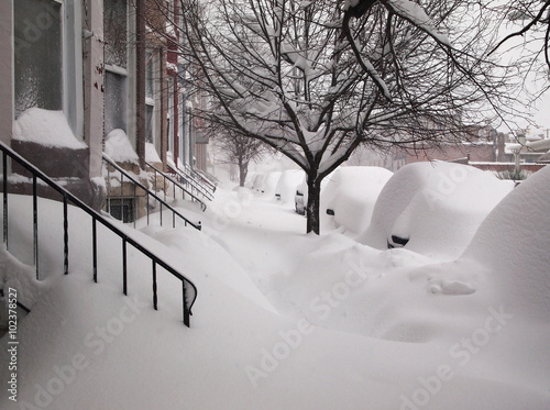 Snow Covered Sidewalk and Cars