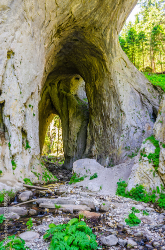 detail of the famous wonderful bridges in bulgaria which are a natural rock formation formed by a small river going through middle of a hill. photo