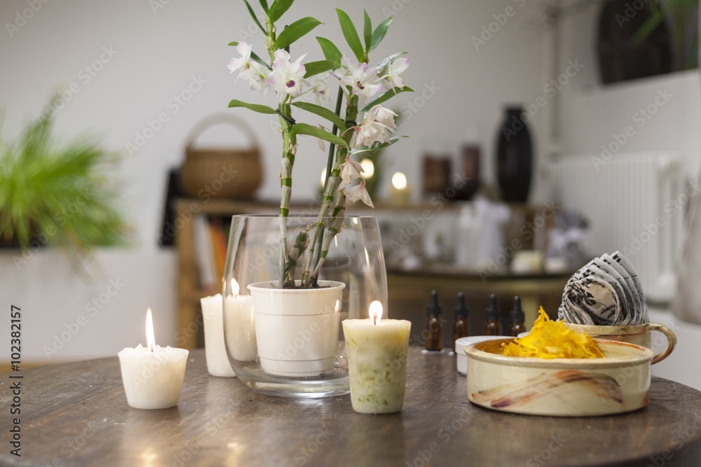 Flowers, candles and healthy snacks on the beauty salon table