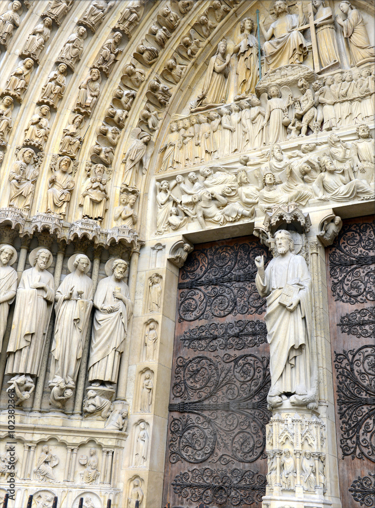 Close up of artwork and carvings in the Notre Dame Cathedral, situated along the Seine River in Paris, France