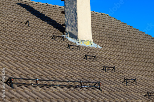 The roofing tiles house roof with chimney sky background photo