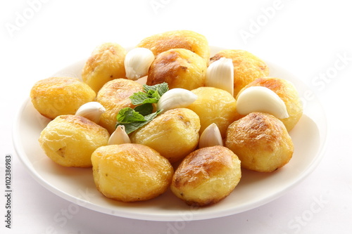 Homemade baked potatoes with garlic.Selective focus .