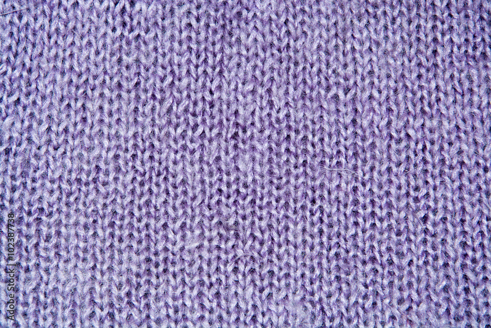 Lilac color wool knitted background closeup Lilac color wool knitted background closeup