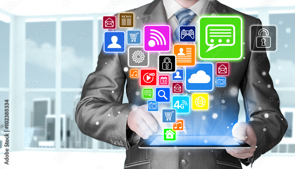 Business man using tablet PC with social media icon set Business man using tablet PC with social media icon set