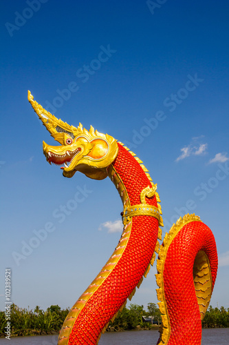 Heads of Naka or Naga or serpent statue with blue sky