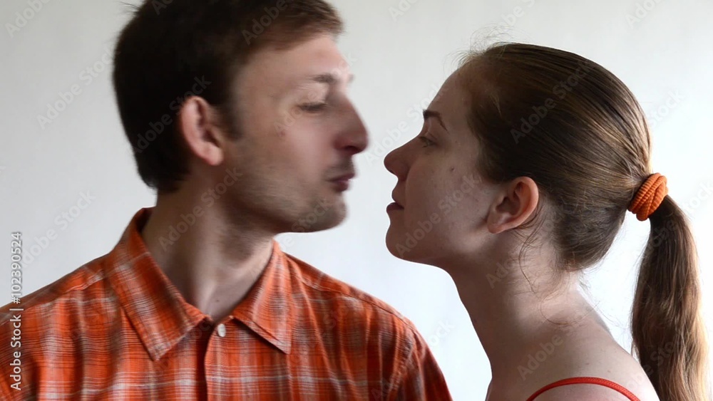 A woman comes to a man and kisses him. He kisses her back. A woman comes to a man and kisses him. He kisses her back.