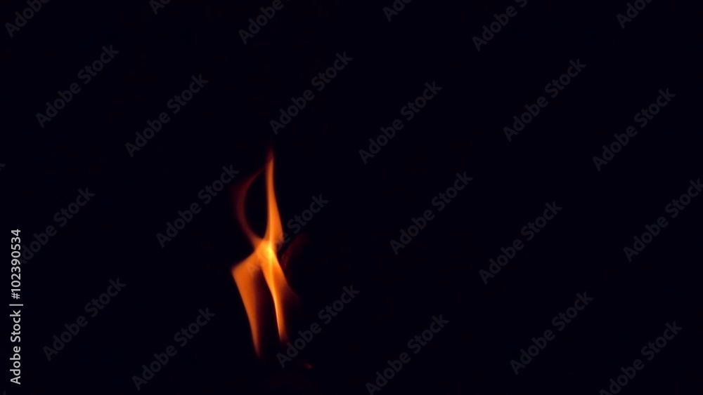 Candle fire light in Black background slow motion shot 