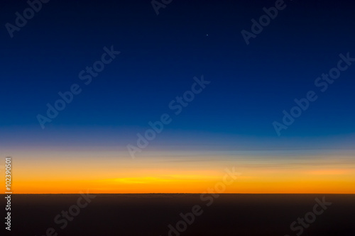Sunrise above the earth from a plane © PawelG Photo