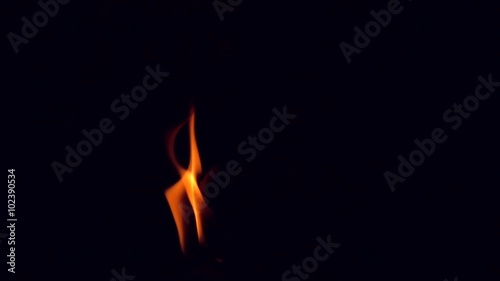Candle fire light in Black background slow motion shot 