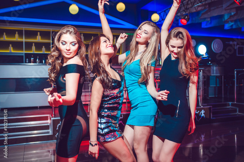 Beautiful girls having fun at a party in nightclub