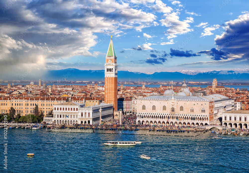 Piazza San Marco with Bell Tower and the Doge Palace against Italian Alps in Venice, Italy