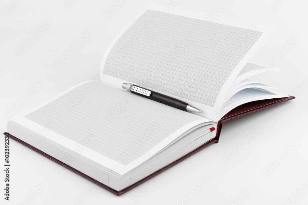Black ballpoint pen in the center of diary Black ballpoint pen in the center of diary