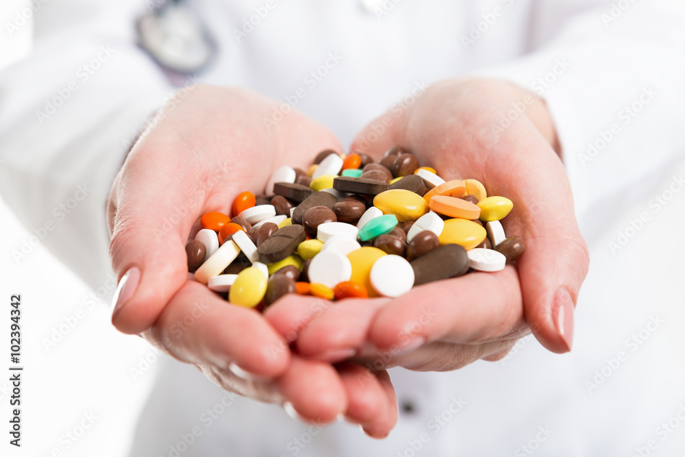Pills in hands of doctor. Photo closeup. Pills in hands of doctor. Photo closeup.