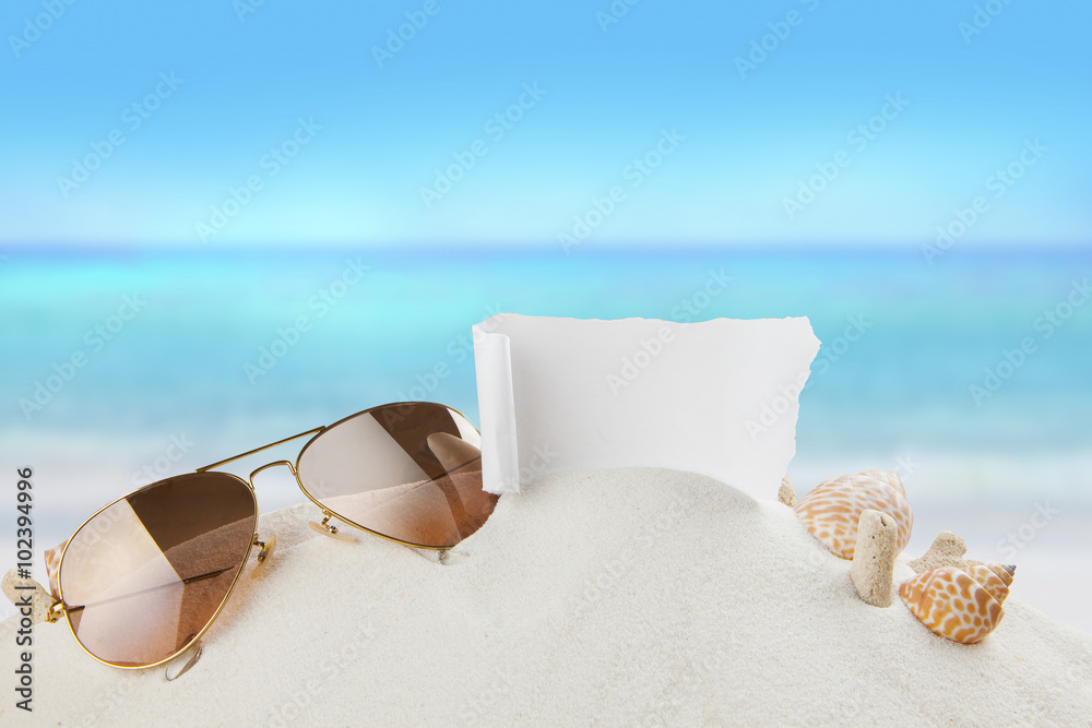 Sunglasses shells on sandy beach, Summer concept 