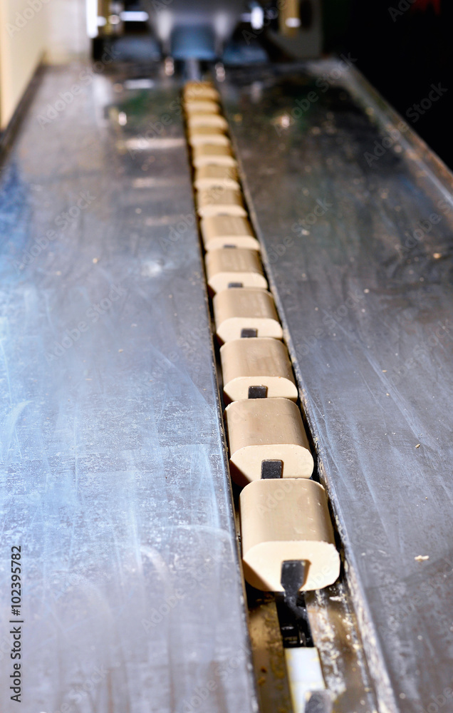 Pieces of soap on a conveyor belt Pieces of soap on a conveyor belt