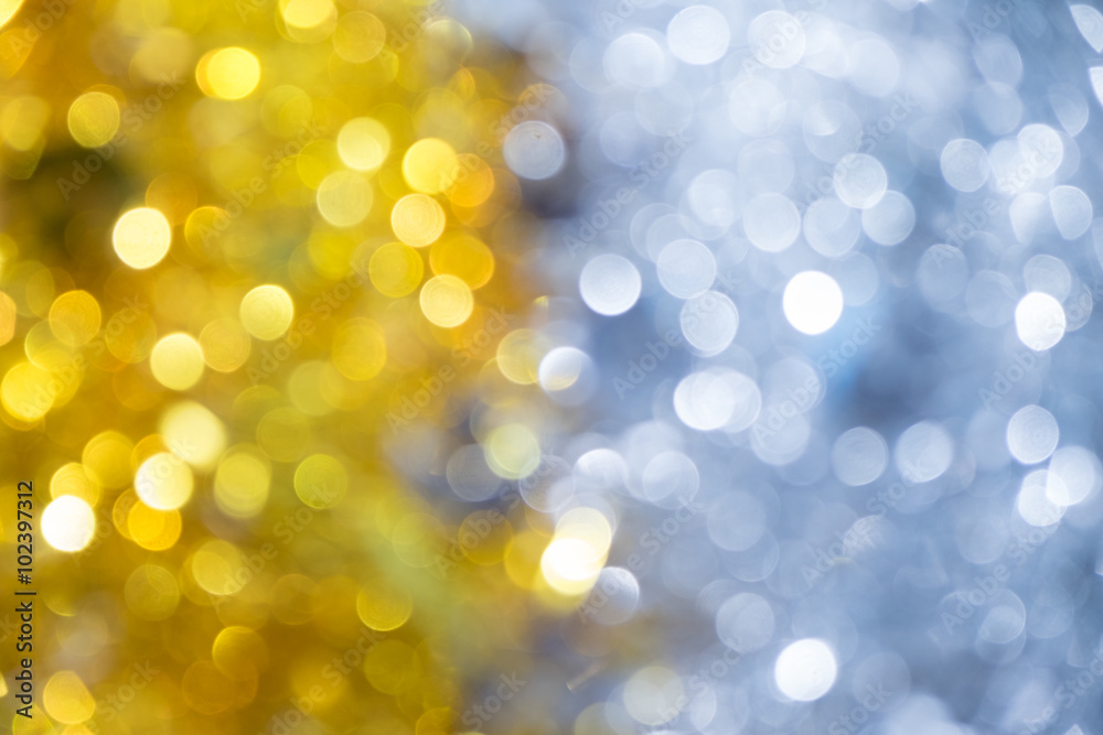 Obraz premium Gold half silver glitter sparkle defocused rays lights bokeh abstract chistmas background.