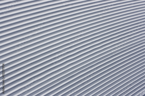 Fresh snow on the corrugated roof