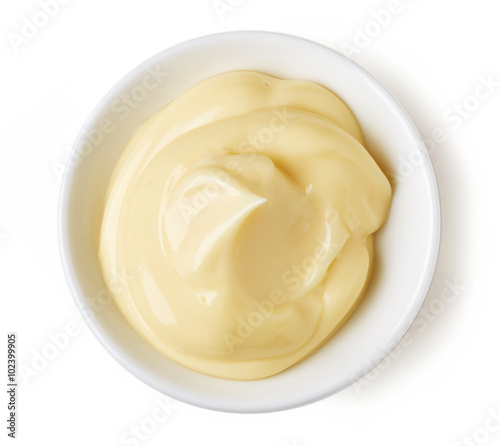Mayonnaise in round dish on white background photo
