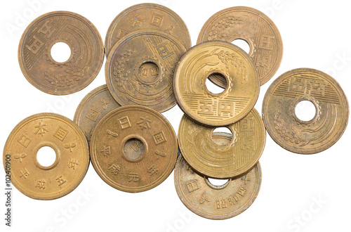 Pile of 5 yen coins japanese money.