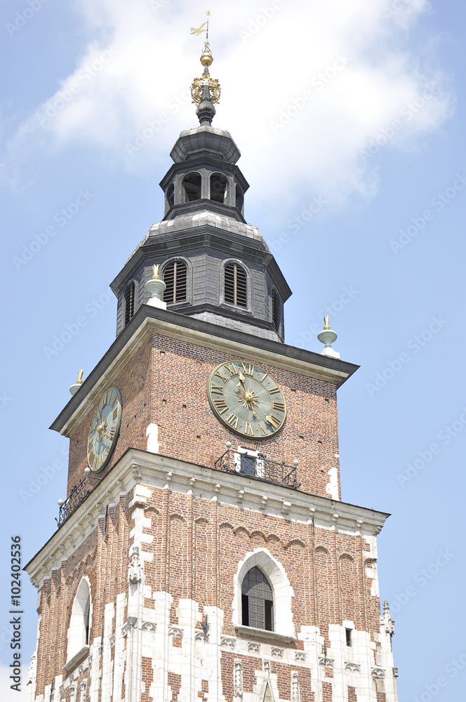 Gothic city hall tower with clock in the Main Market Square of the Old City in Krakow in Poland