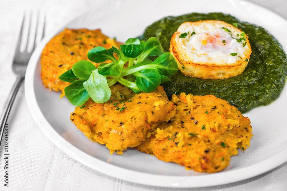 Pumpkin pancake with spinach and fried egg