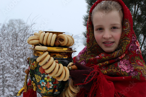 Young russian girl in national clothes, Winter photo