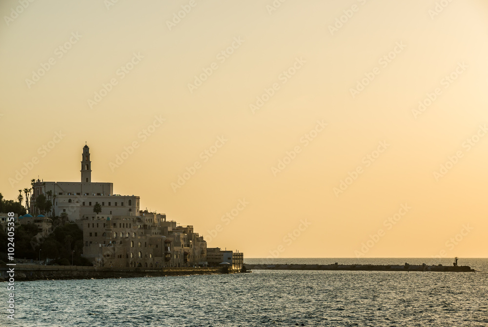 Sunset over Mediterranean Sea and old city of Jaffa in Tel Aviv, Israel