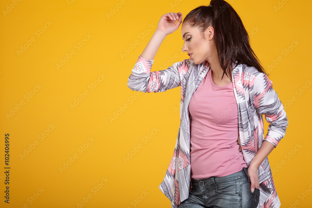 Woman with spring hat against yellow background Woman with spring hat against yellow background