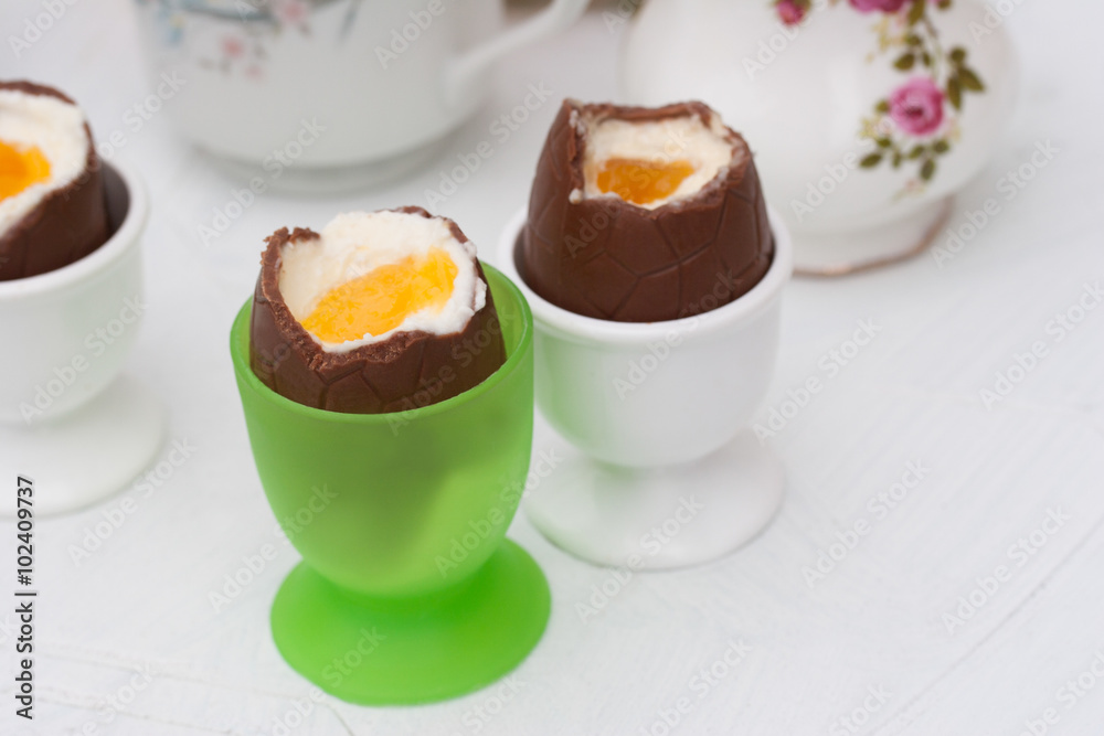 Two homemade chocolate Easter eggs on the white background Two homemade chocolate Easter eggs on the white background