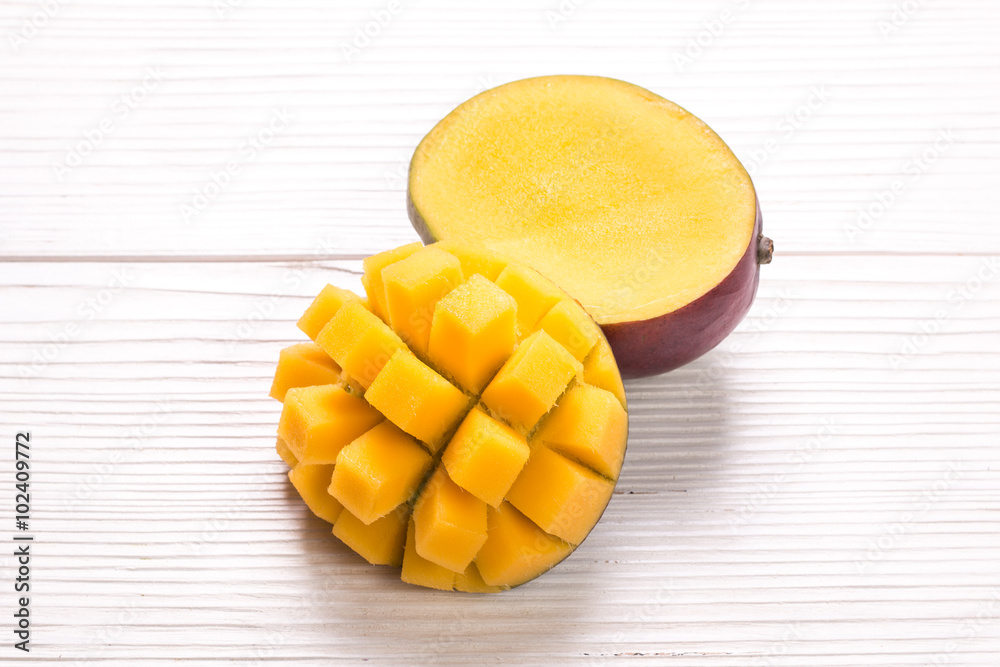 Fresh rip mango on a wooden background.Healthy food