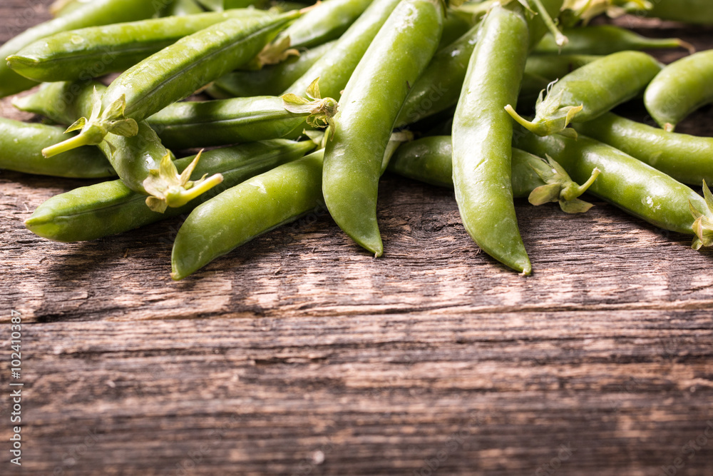 green peas on wooden table ,healthy concept green peas on wooden table ,healthy concept
