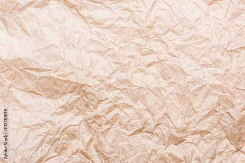 Brown crumpled paper background.