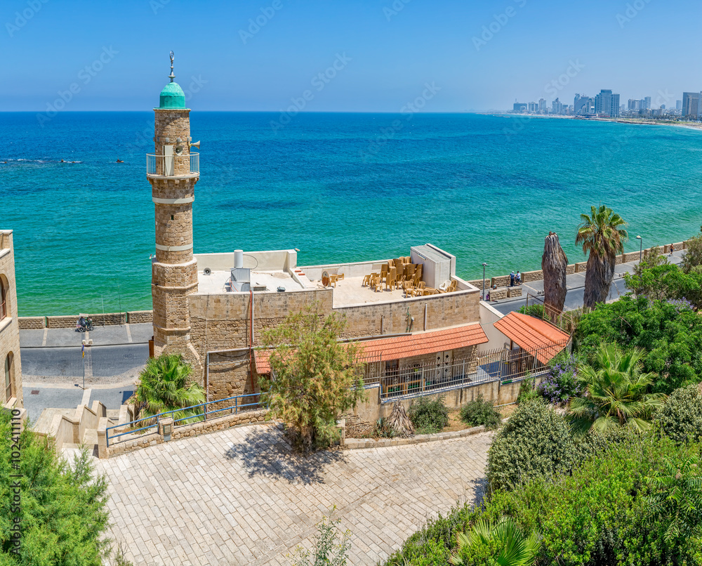 Morning panorama with the Al-Bahr Mosque in Jaffa with view of the beach, Tel Aviv riviera and hotels in distant, Israel.
