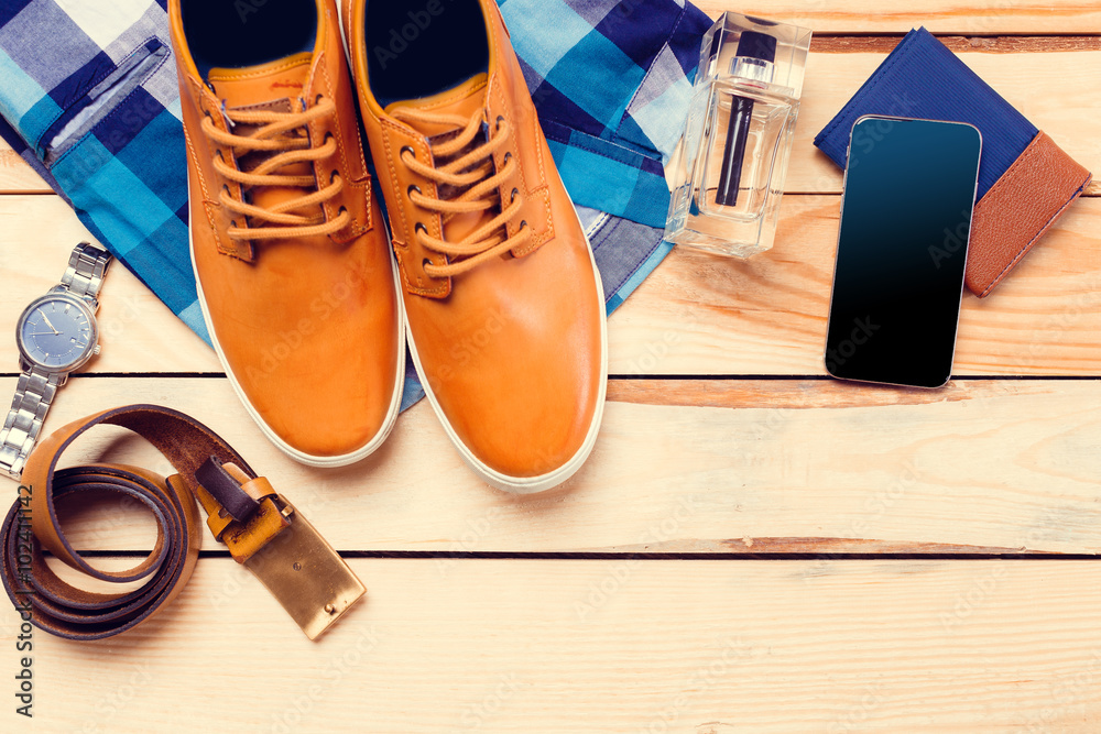Men's casual clothes on wooden background Men's casual clothes on wooden background