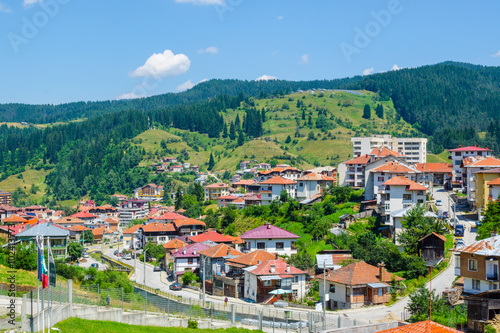 aerial view of bulgarian city chepelare which is famous ski resort and place of traditional rozhen folklore dances festival. photo