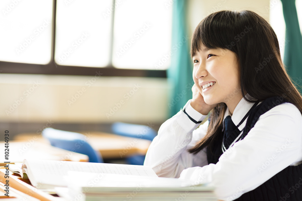 happy pretty student girl with books in classroom happy pretty student girl with books in classroom