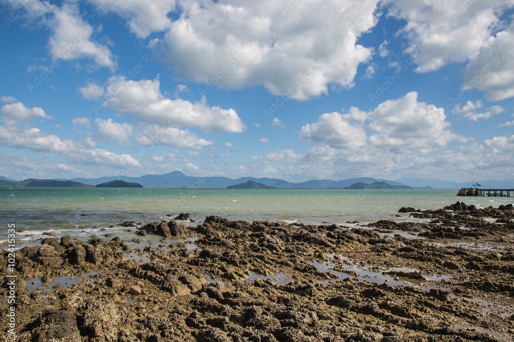 Nature of rocks on the beach under beautiful of clouds and blue sky. Nature of rocks on the beach under beautiful of clouds and blue sky.