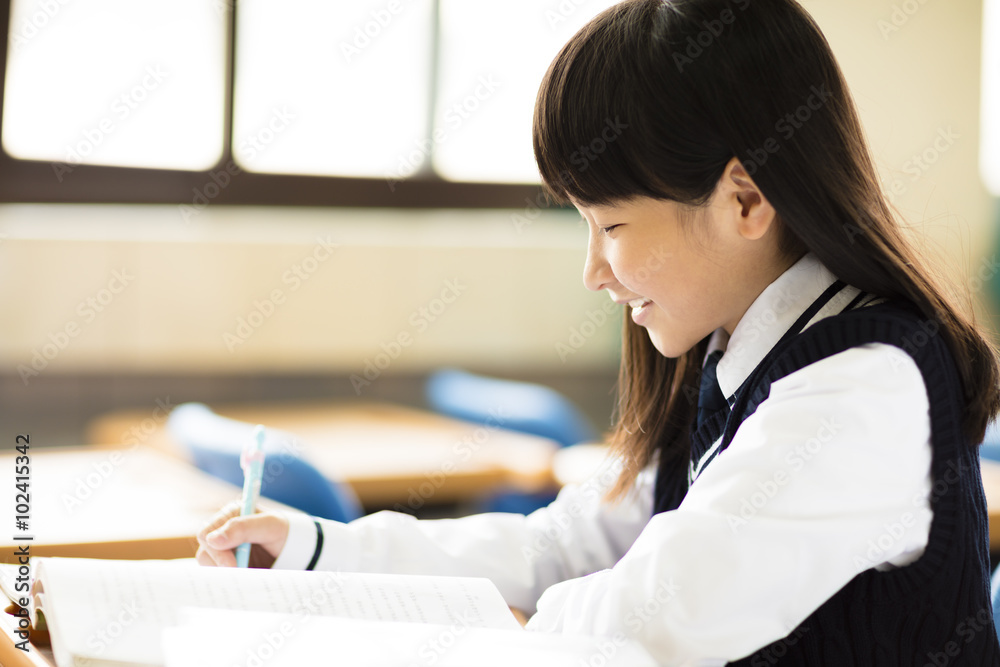 happy pretty student girl with books in classroom happy pretty student girl with books in classroom