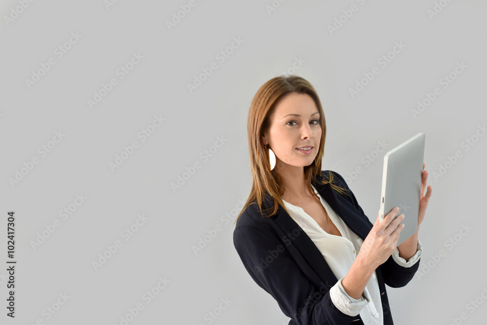 Beautiful woman using tablet, grey background Beautiful woman using tablet, grey background